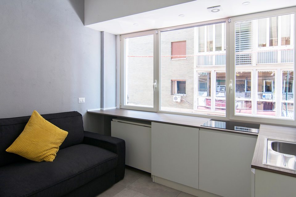 Sofa and counter beneath the window.